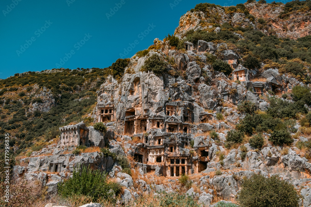 Naklejka premium Ancient lycian rock tomb ruins in Demre, former Myra, Antalya, Turkey