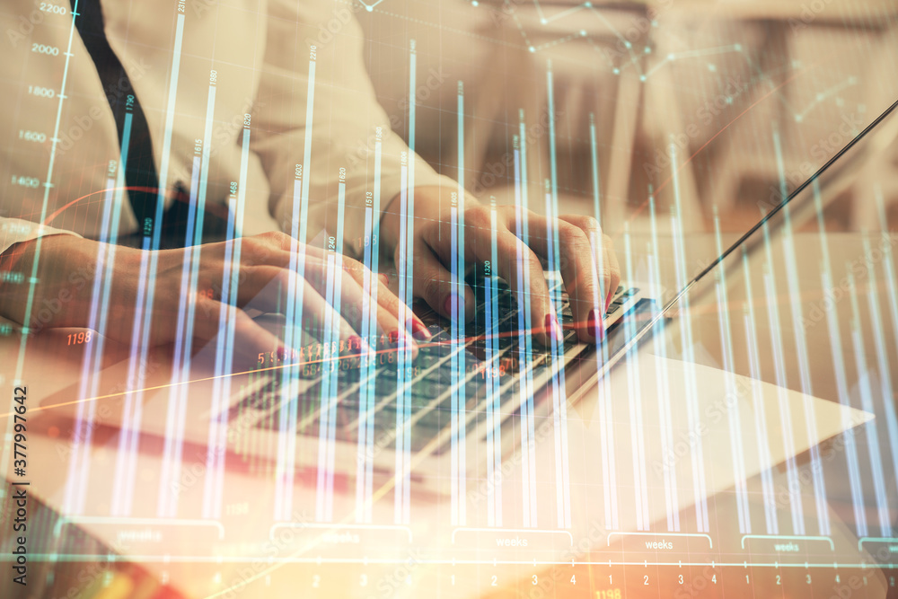 Multi exposure of woman hands typing on computer and financial graph hologram drawing. Stock market analysis concept. Multi exposure of woman hands typing on computer and financial graph hologram drawing. Stock market analysis concept.