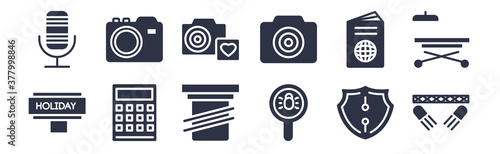 12 pack of black filled icons. glyph icons such as spotlights, search bug, calculation, international passport, camera front view, camera and heart picture, digital photo camera for web and mobile