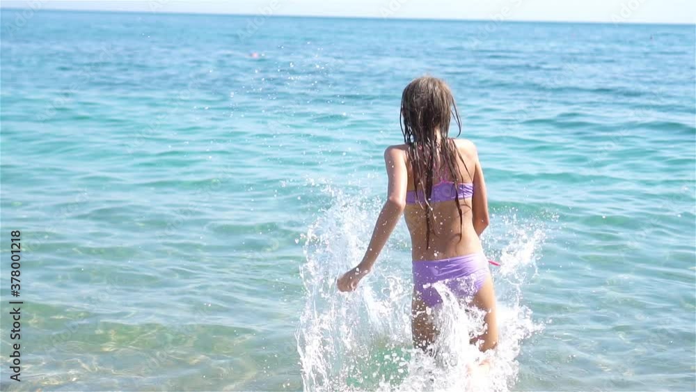 Cute little girl at beach during summer vacation Cute little girl at beach during summer vacation