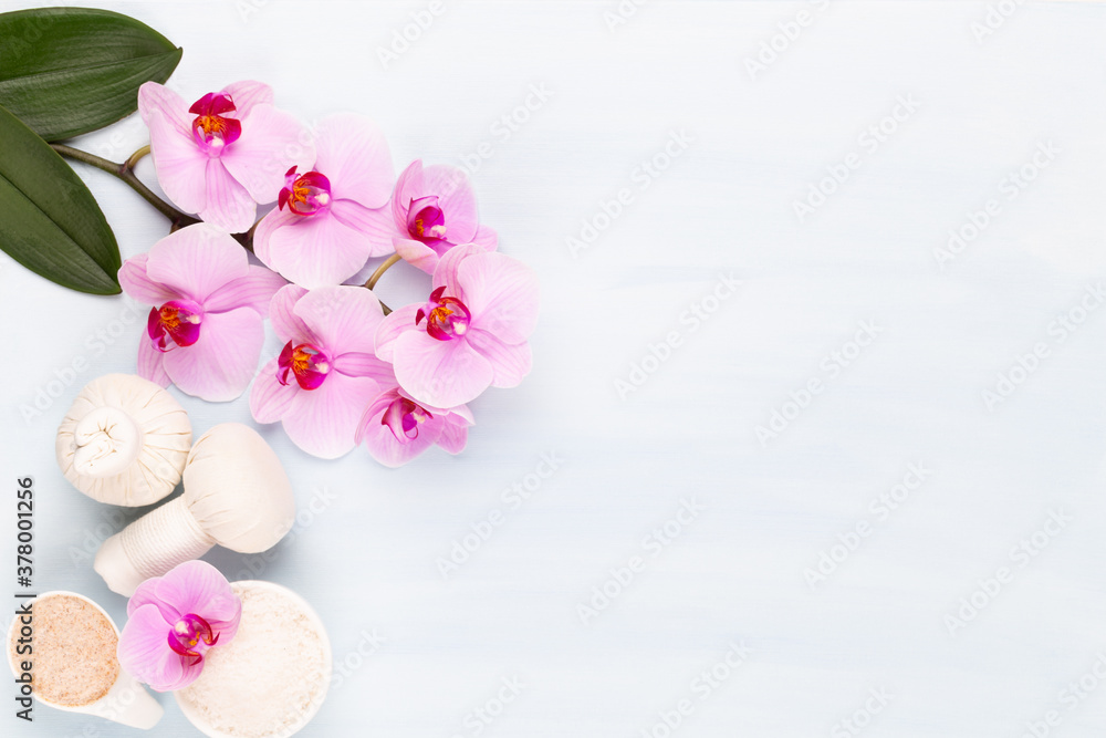 Sea salt, aromatherapy oil in bottles and orchid on vintage wooden background. Sea salt, aromatherapy oil in bottles and orchid on vintage wooden background.