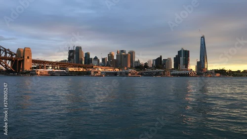 Wallpaper Mural Sun lit sunset in Sydney over city CBD landmarks on shores of Harbour as 4k.
 Torontodigital.ca