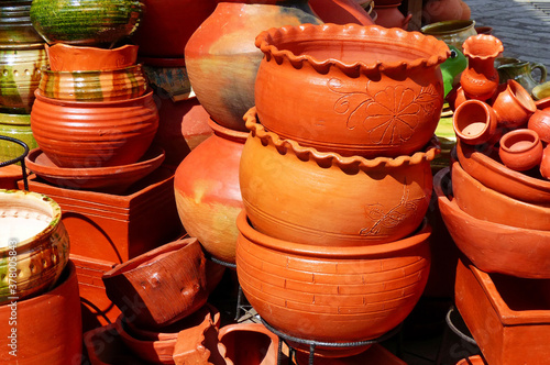 Traditional handmade clay pots for plants at the market in Cuenca, Ecuador © Iryna
