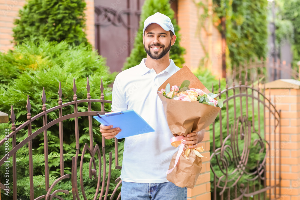 Delivery man with bouquet of beautiful flowers outdoors Delivery man with bouquet of beautiful flowers outdoors
