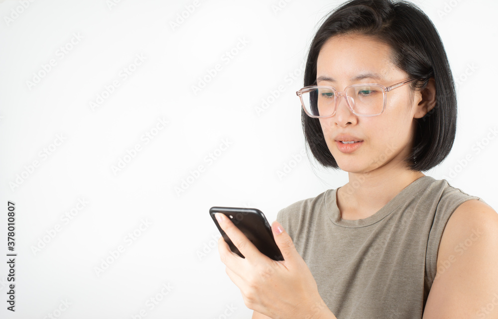 A cute Asian woman with short black hair, white teeth and big eyeglasses is smiling happily. A cute Asian woman with short black hair, white teeth and big eyeglasses is smiling happily.