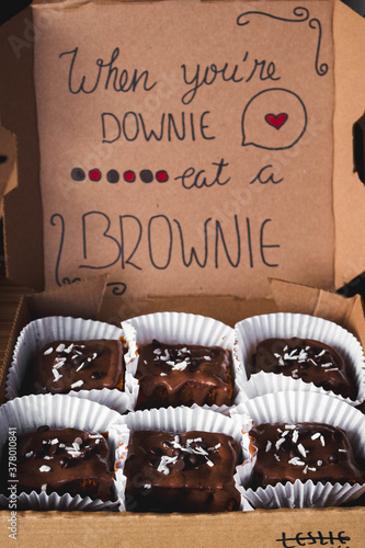 Shot of brownies in a box with an inscription 