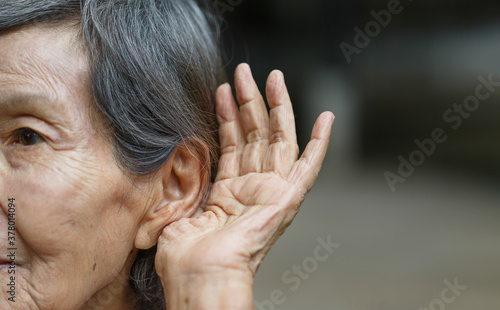 Elderly woman hearing loss , Hard of hearing photo