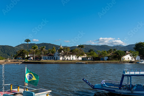 Brazilian historical town landscape with colonial church viewed from a traditional boat © Giorgio G