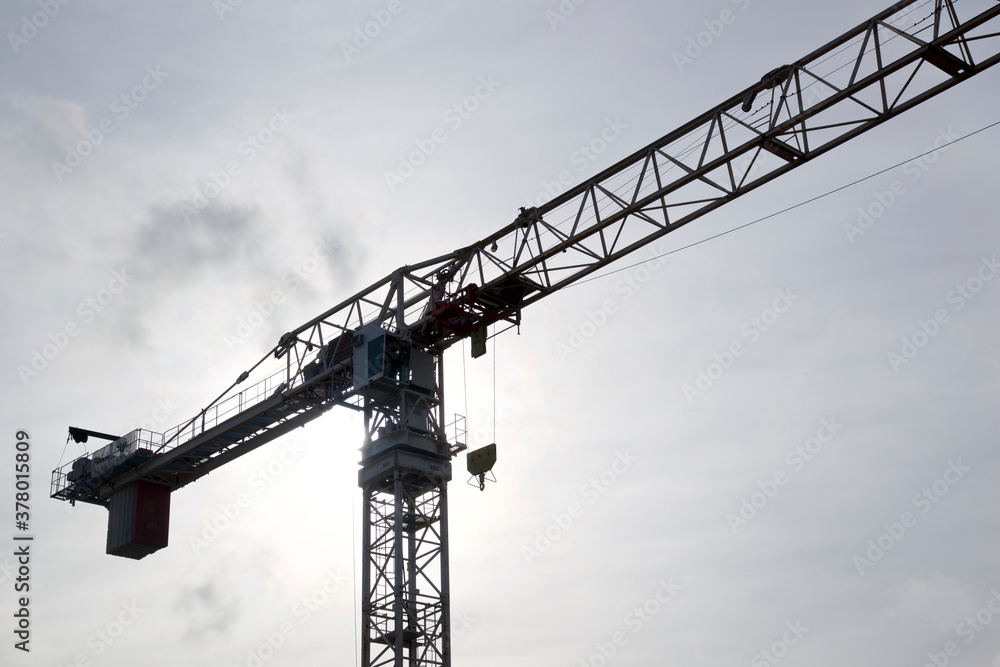 Silhouette of the construction crane in a construction site, Toronto, Ontario, Canada Silhouette of the construction crane in a construction site, Toronto, Ontario, Canada