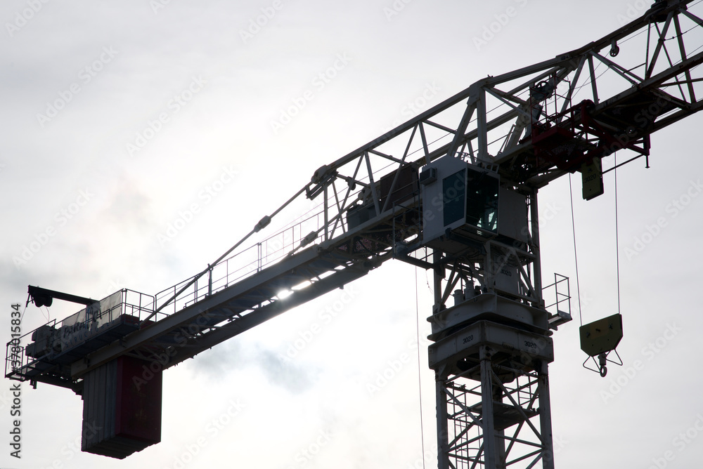 Silhouette of the construction crane in a  construction site, Toronto, Ontario, Canada