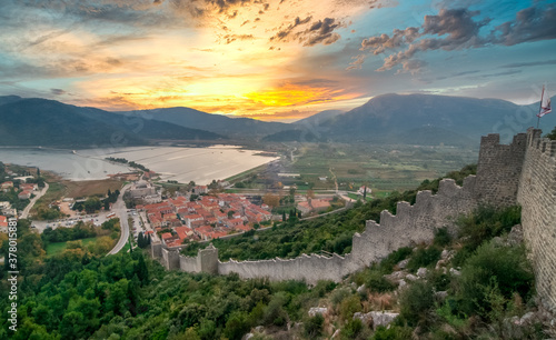 Dreamy sunset sky above Maly Ston castle and salt mines on the Adriatic Coast of Croatia