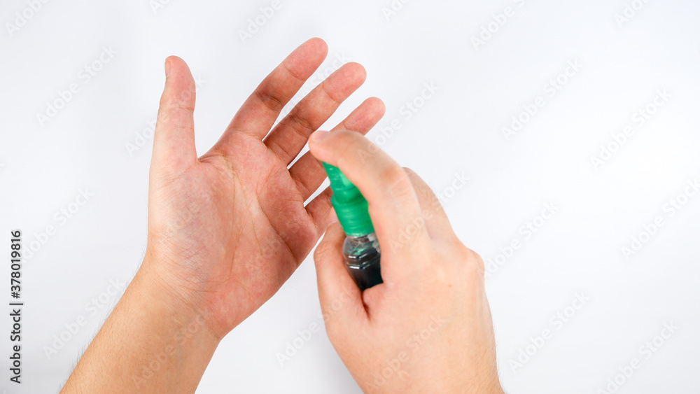 Spraying of alcohol on your hand on during COVID 19 pandemic Spraying of alcohol on your hand on during COVID 19 pandemic