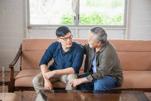 Senior asian father give advice adult son in living room, Happiness family concepts
