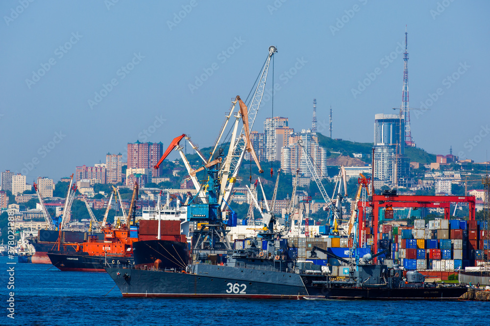 Commercial coasters are loading at the commercial port of Vladivostok.