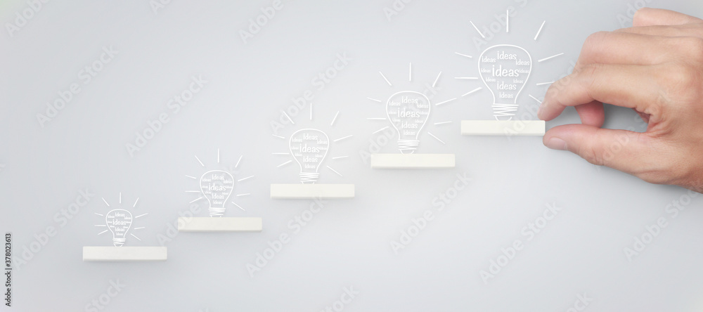 Block stacking as step stair in hand. Business concept for growth Block stacking as step stair in hand. Business concept for growth