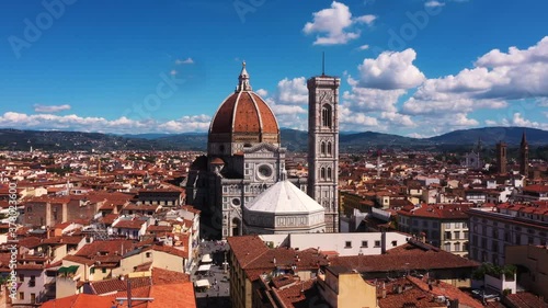 Wallpaper Mural Drone rising high overlooking Cathedral of Santa Maria del Fiore and city on a sunny day in Florence in Italy in 4k. Torontodigital.ca