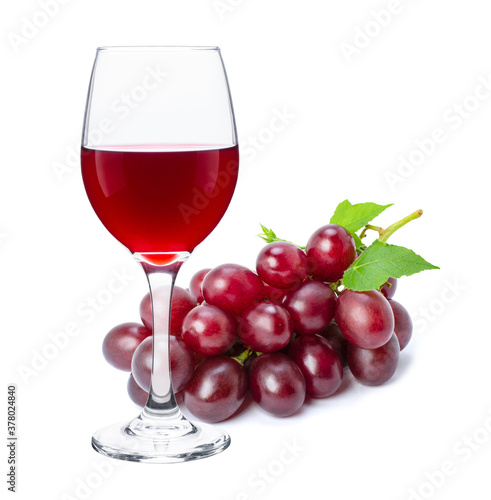 Red wine in wineglass with red grapes isolated on white background. 