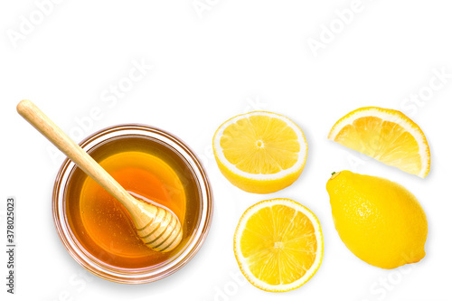 Whole ans half slice of lemon lime fruit with honey isolated on white background. Top view. Flat lay.