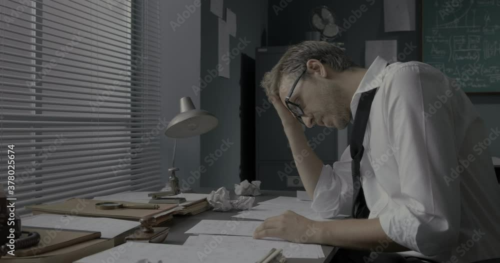Creative mathematician working in his office Creative mathematician working in his office