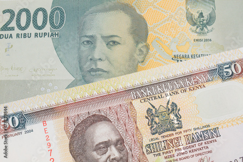 Konstfotografi A macro image of a grey two thousand Indonesian rupiah bank note paired up with a colorful fifty shilling bank note from Kenya