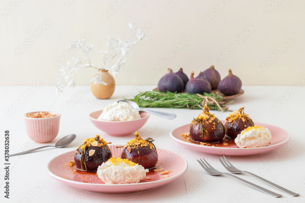 Caramelised figs with balsamic vinegar, rosemary, almonds and cottage cheese. Slow roasted homemade fruit dessert. White wooden table background. No people. Gordon Ramsey recipe. Caramelised figs with balsamic vinegar, rosemary, almonds and cottage cheese. Slow roasted homemade fruit dessert. White wooden table background. No people. Gordon Ramsey recipe.