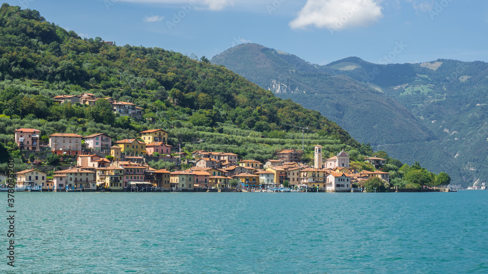 The village of Carzano from the boat. Village located on the Island of Montisola. Lake Iseo. North Italy. Tourists destination