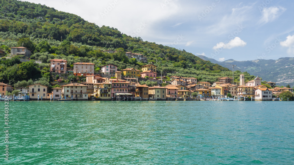 The village of Carzano from the boat. Village located on the Island of Montisola. Lake Iseo. North Italy. Tourists destination