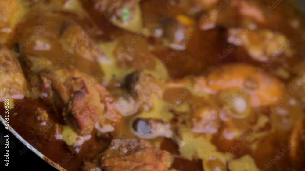 indian style homemade spicy chicken recipe cooking in a pan by chef, stirring chicken curry and cooking chicken recipe, non-veg food coooking indian style homemade spicy chicken recipe cooking in a pan by chef, stirring chicken curry and cooking chicken recipe, non-veg food coooking