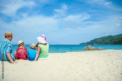 happy family at sea in greece on nature background