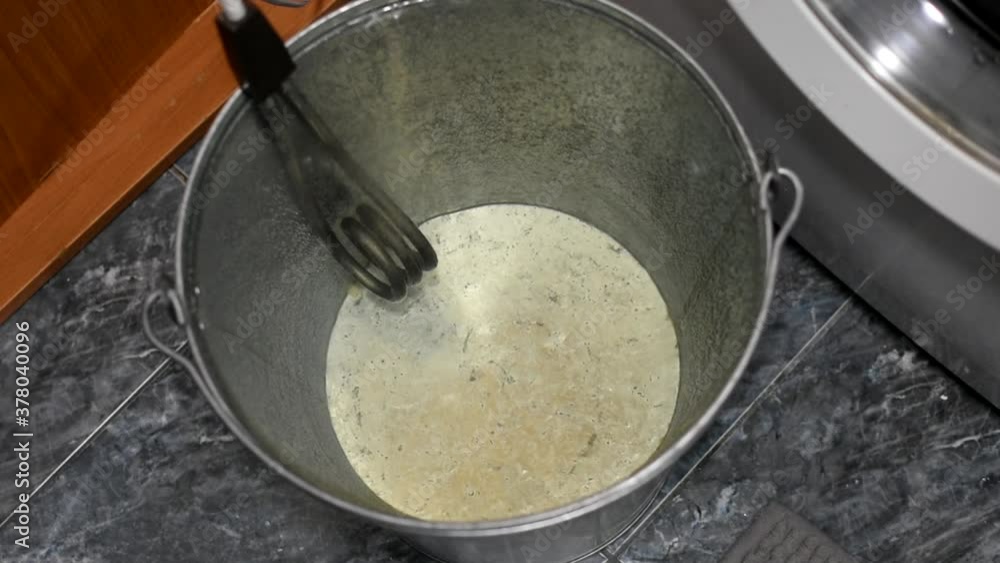 A portable electric boiler immersed in water becomes covered with air bubbles from boiling. Close up. A portable electric boiler immersed in water becomes covered with air bubbles from boiling. Close up.