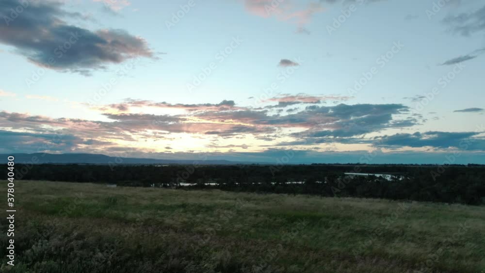 Aerial Drone Shot flying over Timothy Grass Field in Lethbridge Alberta Canada at Sunset Aerial Drone Shot flying over Timothy Grass Field in Lethbridge Alberta Canada at Sunset