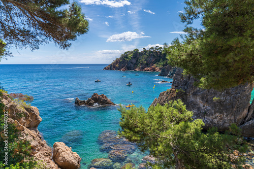 Views of the coast in "Punta des Forcats" with boats in Calella de Palafrugell.