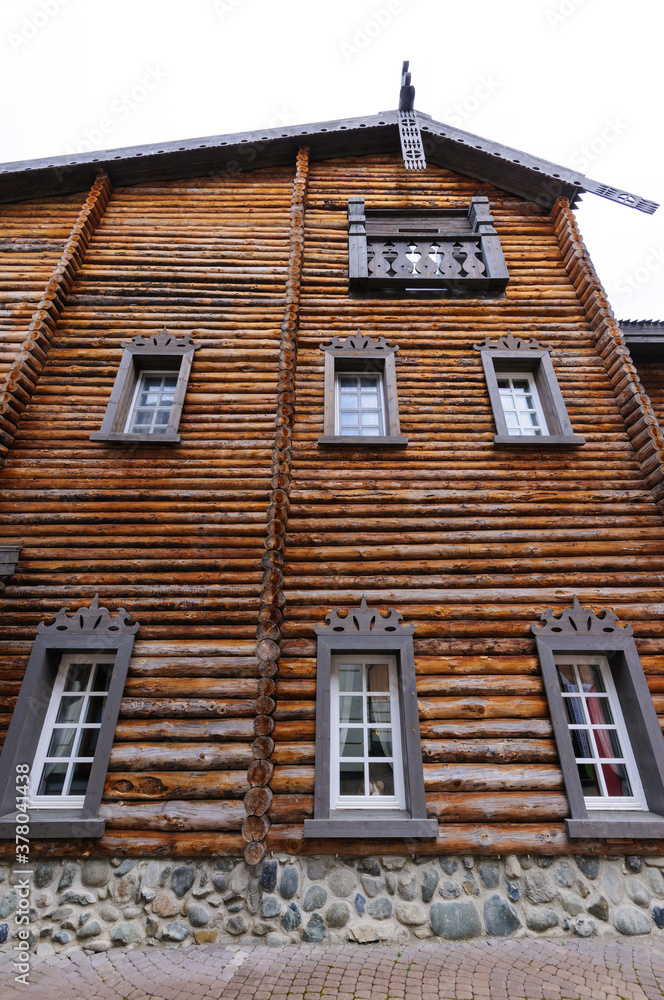 A wooden house made of circular timber