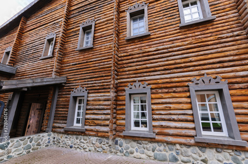 A wooden house made of circular timber