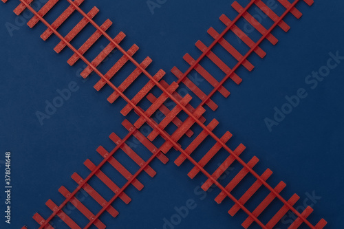 Toy railroad on a blue classic background. Top view photo