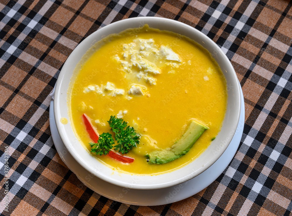 Pumpkin soup with white cheese and avocado at Quito restaurant, Ecuador. Pumpkin soup with white cheese and avocado at Quito restaurant, Ecuador.