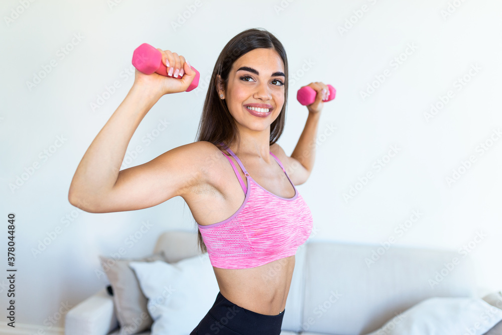 Athletic woman doing exercise for arms. Fitness model working out with dumbbells. Woman exercising with dumbbells. Fitness, workout, healthy living and diet concept. woman doing gymnastic exercises. Athletic woman doing exercise for arms. Fitness model working out with dumbbells. Woman exercising with dumbbells. Fitness, workout, healthy living and diet concept. woman doing gymnastic exercises.