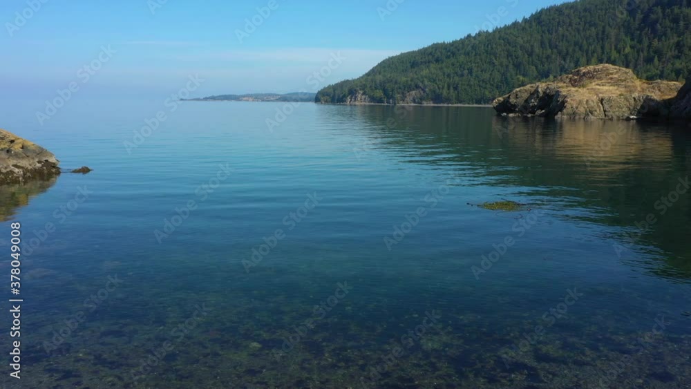 Boating in the San Juan Islands of Washington State. Lummi Rocks is a small rock outcropping just to the south and west of Lummi Island perfect for a small boat to land and enjoy a picnic lunch. Boating in the San Juan Islands of Washington State. Lummi Rocks is a small rock outcropping just to the south and west of Lummi Island perfect for a small boat to land and enjoy a picnic lunch.