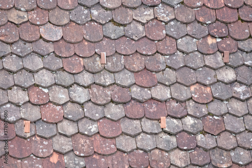 Old roof with odd rooftiles photo