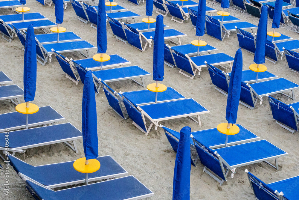 View of Blue Sun Beds and Umbrellas on a Monterosso al Mare Beach, Cinque Terre