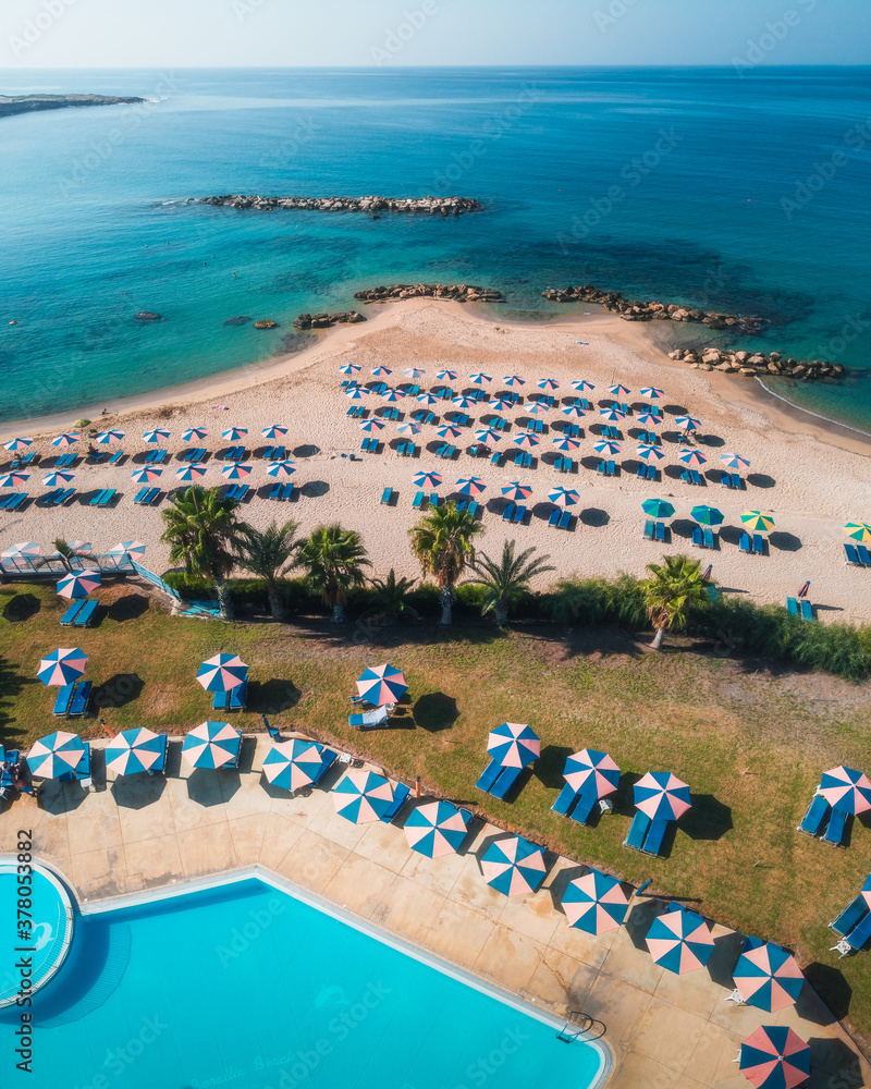 Fantastic drone shot of Laourou Beach, also known as Corallia Beach - one of the best beaches in Cyprus near Coral Bay, Paphos district, Cyprus