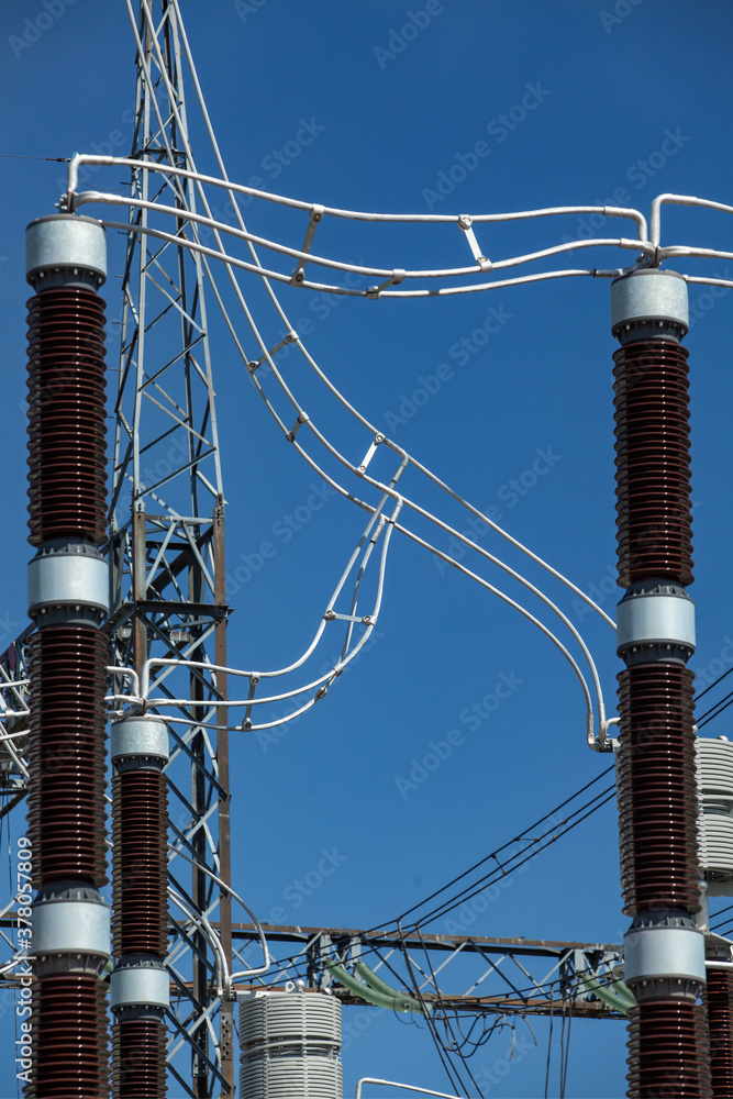 Close-up of insulators and wires on transformer substation of power ...
