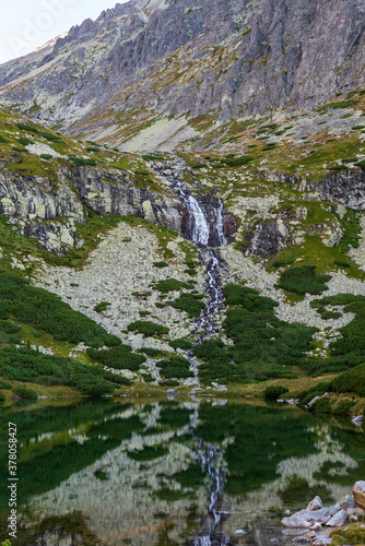 Velicky vodopad waterfall with Velicke pleso lake in Velicka dolina valley in Vysoke Tatry mountains in Slovakia photo