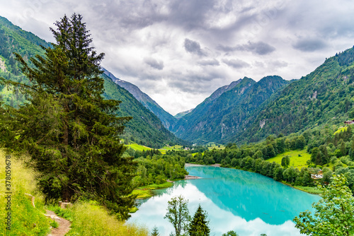 Klamsee - mountain water reservoir above Kaprun town with bright turquoise blue water, Austria