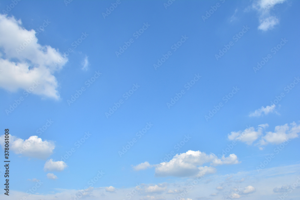 Fototapeta premium Blue Sky With Scattered Clouds With A Sun 