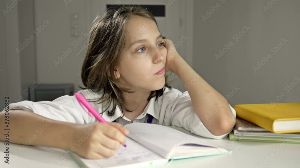 Tired schoolboy falls asleep doing her homework. Back to school. Tired schoolboy falls asleep doing her homework. Back to school.