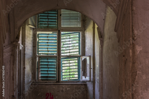 window with wooden sun protection in a castle