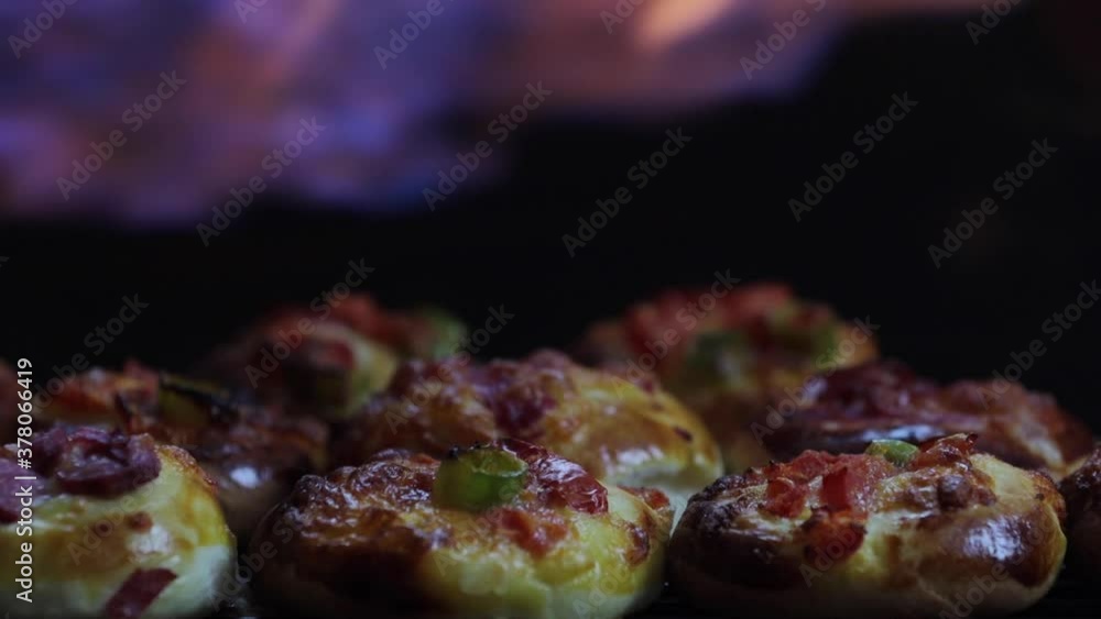 mini Pizzas and flame background. High quality FullHD footage mini Pizzas and flame background. High quality FullHD footage