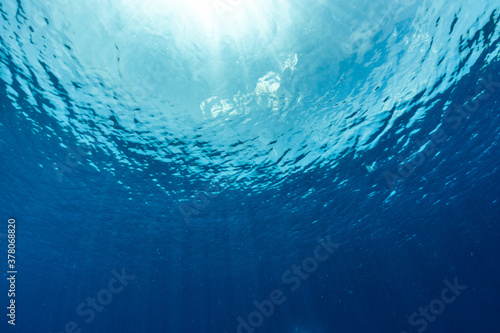 Underwater of tropical; sun rays passing through water.