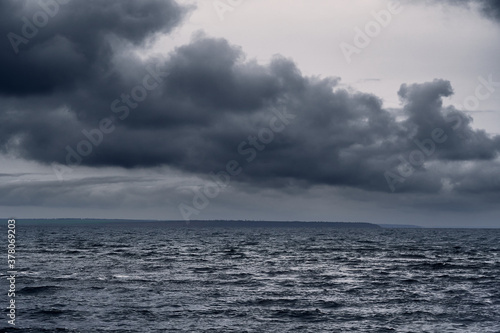 Fototapeta Naklejka Na Ścianę i Meble -  dark stormy sea and dramatic clouds, gloomy nature